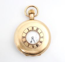 A yellow metal half hunter pocket watch, the circular white enamel dial with Roman Numerals and