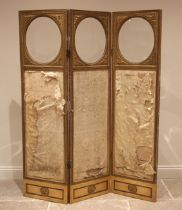 A Victorian giltwood and gesso silkwork three panel dressing screen, each panel with a circular