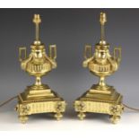 A pair of Victorian lacquered brass lamp bases, late 19th century, the invert break front base