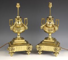 A pair of Victorian lacquered brass lamp bases, late 19th century, the invert break front base