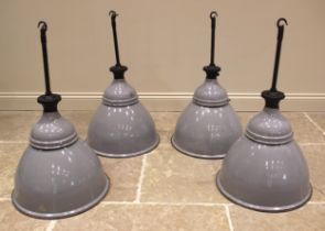 A set of four vintage Benjamin enamelled pendant industrial lamps, mid 20th century, each with a