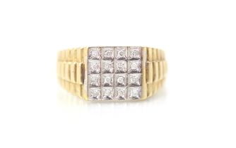 A yellow metal and diamond set dress ring, the white metal head set with round cut diamonds with