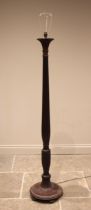 A Regency style mahogany standard lamp, early 20th century, the reeded acanthus column extending