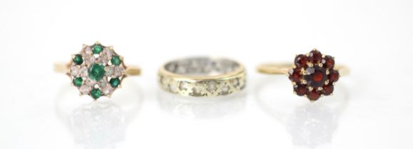 A selection of three dress rings, including a 9ct red stone set cluster ring, the nine round cut