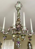 A German porcelain six branch chandelier in the manner of Meissen, 19th century, the central foliate