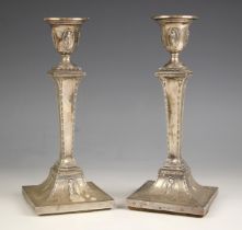 A pair of Edwardian silver candlesticks, Hawksworth, Eyre and Co Ltd, Sheffield 1900, the urn shaped