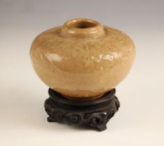 A Chinese Cizhou type ginger jar, Yuan dynasty, of of compressed globular form and moulded with