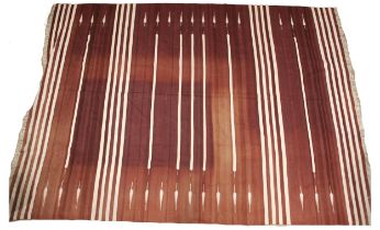 An Oka Kilim, the burgundy ground with cream stripes, punctuated with wheat sheaf type motifs,