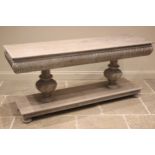 A contemporary limed oak console table in the Elizabethan style, the convex nulled frieze with