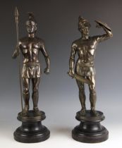 Two Art Deco influence bronze patinated spelter figures, 20th century, each modelled as a Roman