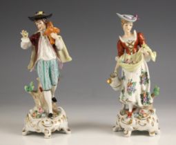 A pair of Sitzendorf porcelain figures, late 19th century, modelled as a courting lady and