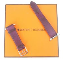 A Hermes Apple watch strap, the aubergine coloured strap stamped to reverse 'Hermes Paris' with