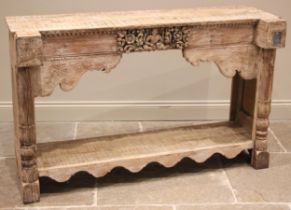 An Indian limed hardwood console table, late 20th/early 21st century, the plank top above a frieze