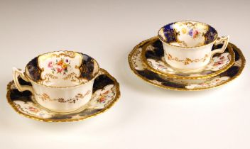 A Coalport porcelain batwing trio, late 19th century, each piece decorated with floral spray