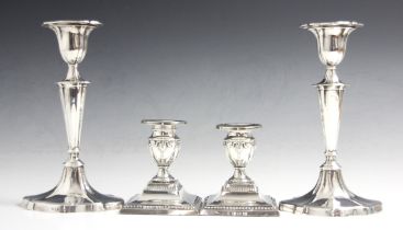 A pair of Edwardian silver candlesticks, Hawksworth, Eyre & Co Ltd, Sheffield 1902, the urn shaped