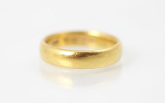 A 22ct yellow gold wedding band, stamped 'HA' Birmingham 1917, ring size M, 6gms