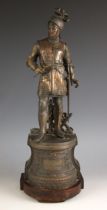 A bronze patinated and copperised spelter figure modelled as Edward The Black Prince in helmet and