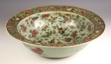 A large Chinese porcelain Canton celadon ground centre bowl, 19th century, the large circular