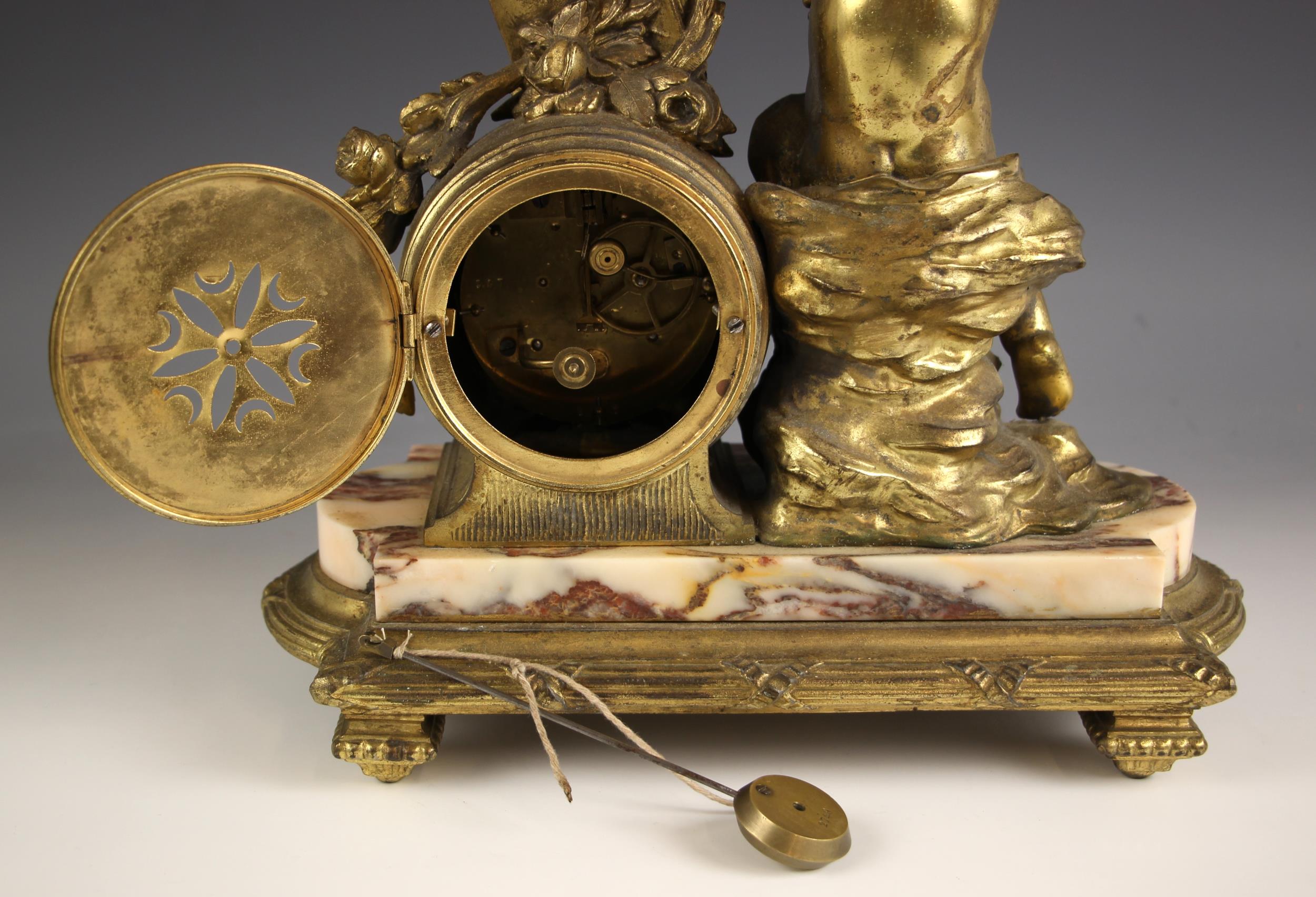 A French gilt metal and rouge marble mantel clock, late 19th century, the case surmounted with a - Image 2 of 2