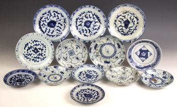 A collection of thirteen Chinese porcelain blue and white plates, Wanli Period and later, each of