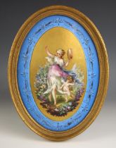 A Sevres porcelain oval plaque, 19th century, the gilt central panel painted with a musical maiden
