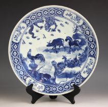 A Chinese porcelain blue and white charger, 19th century, of circular form and decorated with a