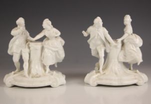 A near pair of German blanc de chine porcelain figural groups, 20th century, each modelled as a
