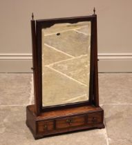 A George III mahogany dressing table mirror, the rectangular mirrored plate within a moulded