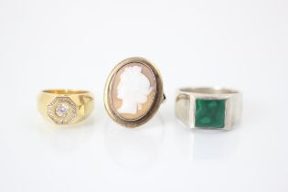 A selection of three dress rings, including a malachite set dress ring, ring size X, a hexagonal '