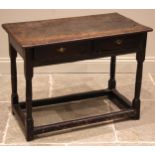 A late 17th/early 18th century oak side table, the rectangular top over two frieze drawers, upon