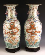 A large pair of Chinese porcelain famille rose vases, 19th century, each baluster shaped vase