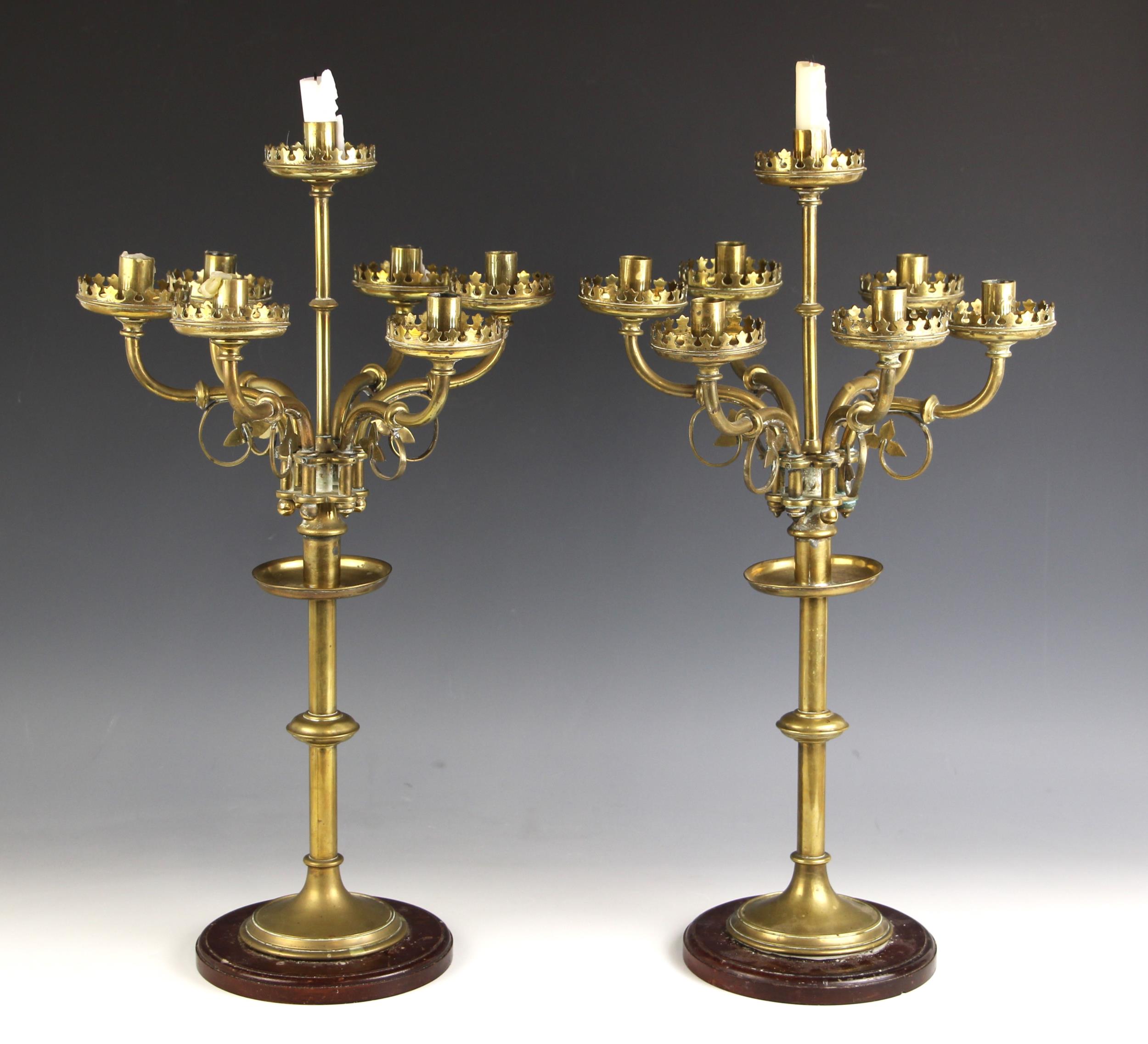 A pair of Ecclesiastical brass six-branch candelabrum with central sconce, late 19th century, each