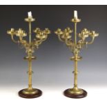 A pair of Ecclesiastical brass six-branch candelabrum with central sconce, late 19th century, each