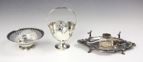 An Edwardian silver inkwell desk stand, William Aitken Birmingham 1906, the central glass well (