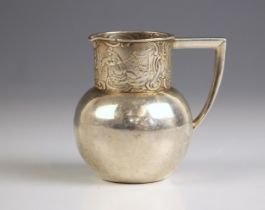 An Edwardian silver cream jug, with import marks for B Muller and Son, Chester 1900, the angular