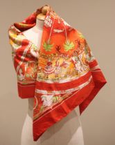 An Hermes silk scarf, in the 'Les Vanikoro ou de la Perouse' pattern, in red, orange, and green