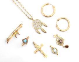 A selection of yellow metal jewellery, including a pair of 9ct yellow gold hollow hoop earrings, a