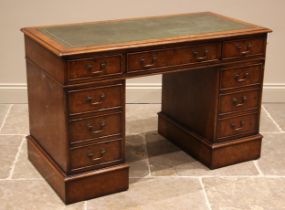 A burr elm veneered twin pedestal desk, late 20th century, the rectangular moulded top inset with