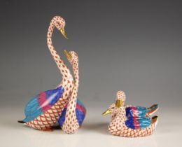 A Herend porcelain figural duck group, 20th century, with red fishnet decoration, printed maker's