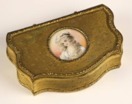 A French gilt metal jewellery casket, 19th century, of serpentine form, the cover inset with a tondo