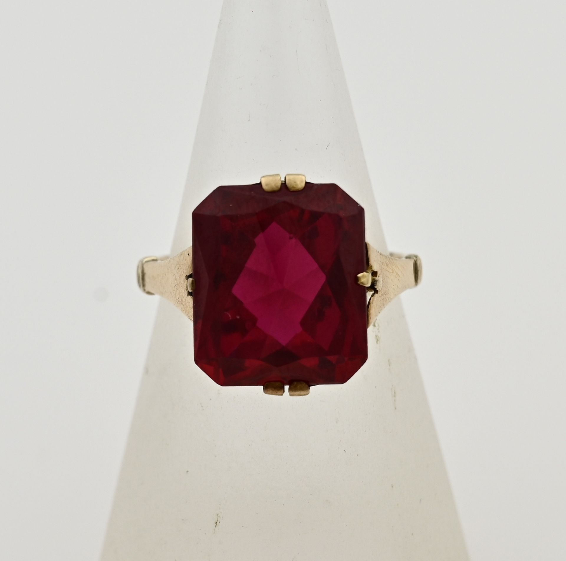 Gold ring with red stone