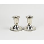 2 silver candlesticks