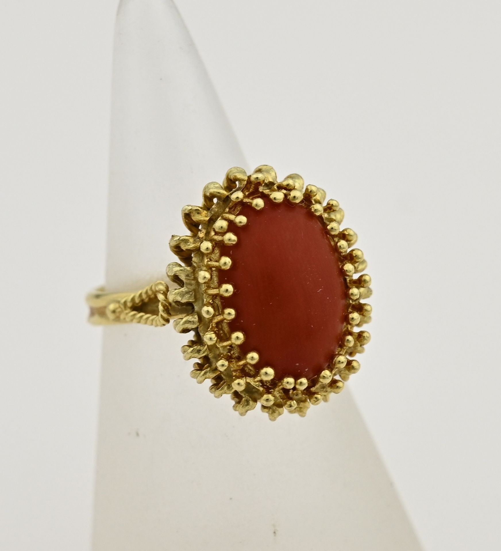 Gold ring with red coral