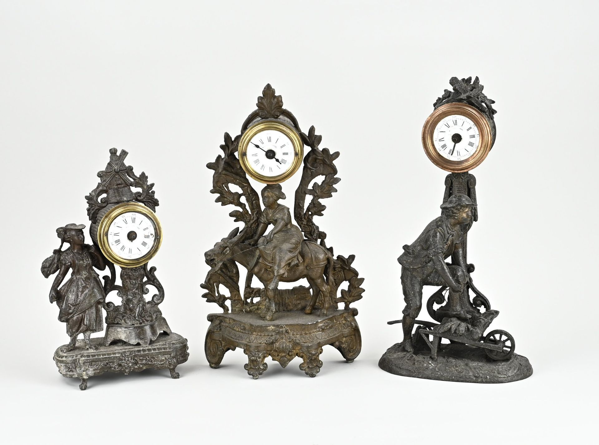 Three antique French alarm clocks, 1900