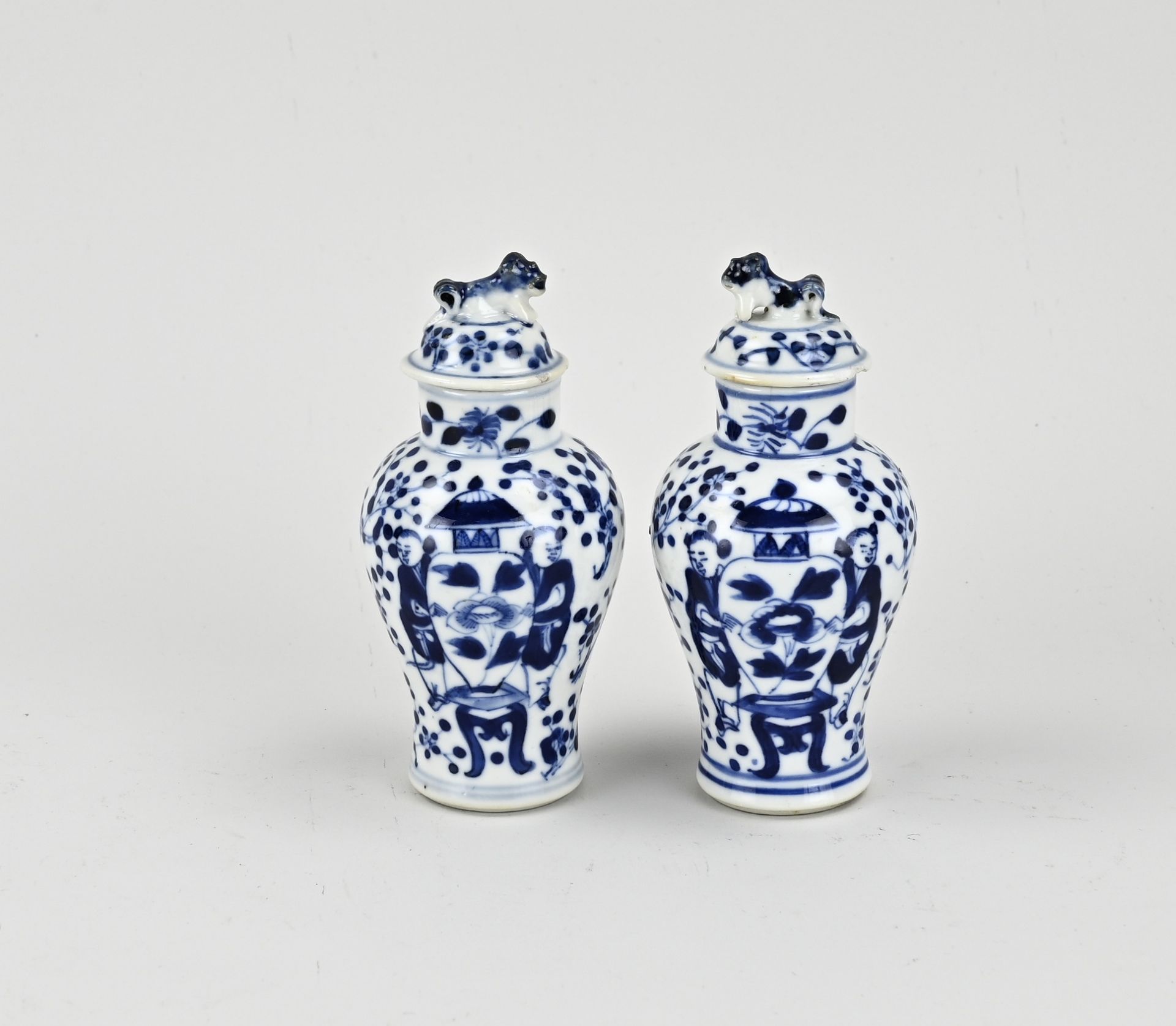 Two small Chinese lidded vases, H 13 cm.