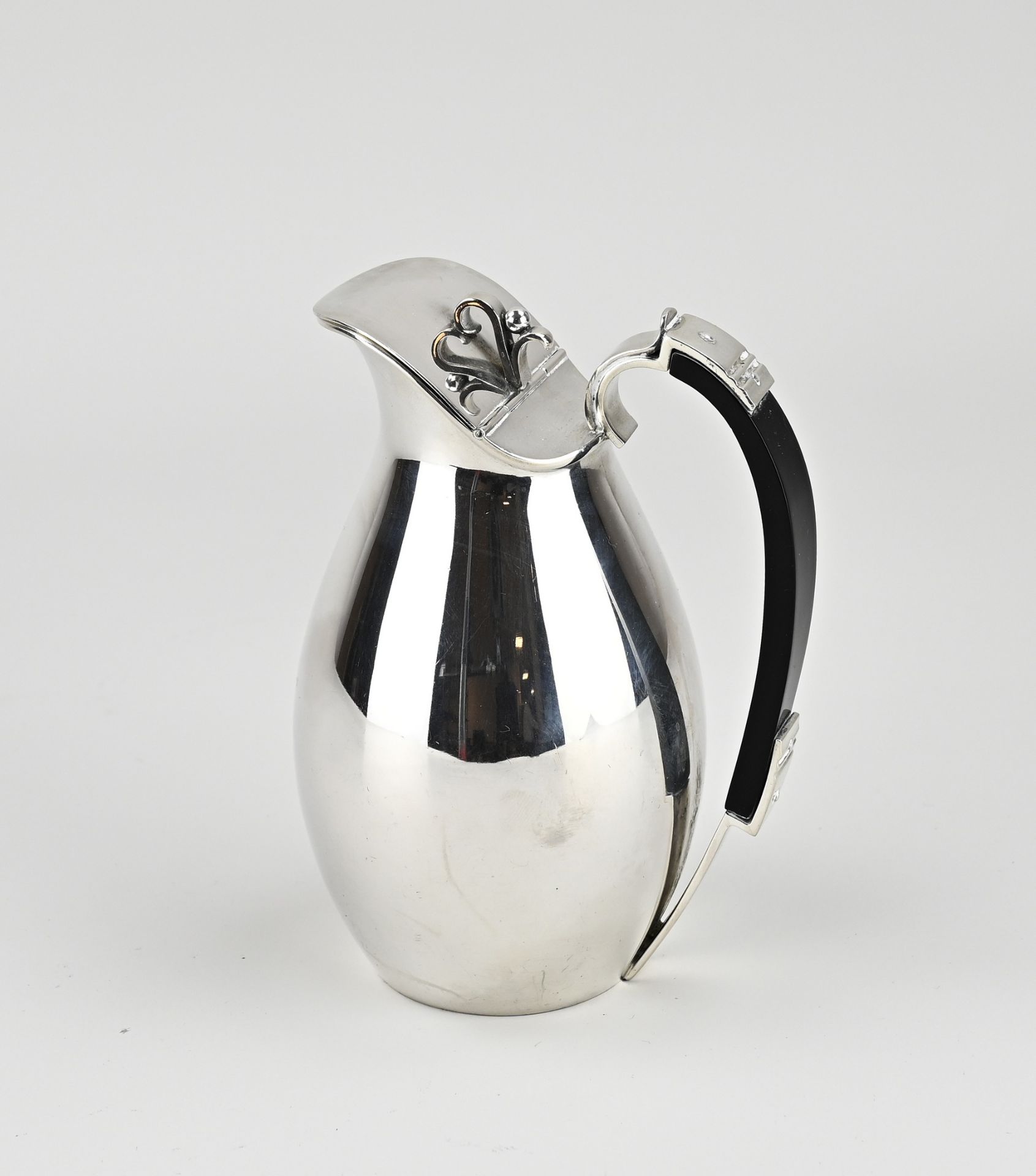 Silver jug with wooden handle