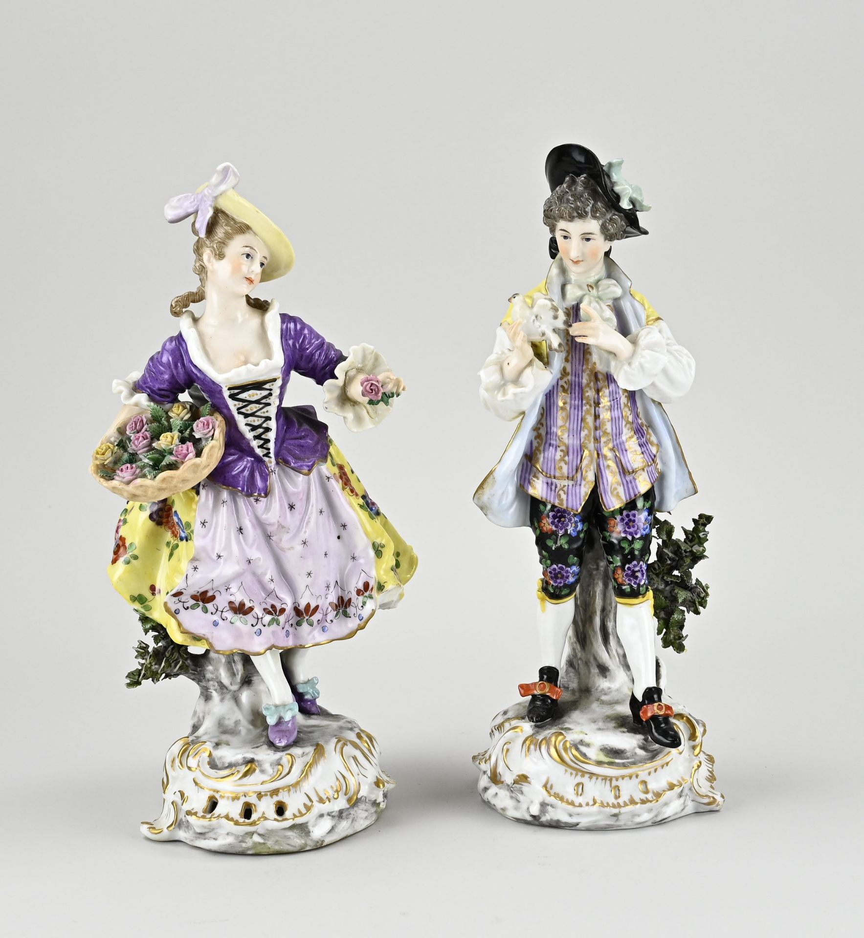 Two porcelain statues
