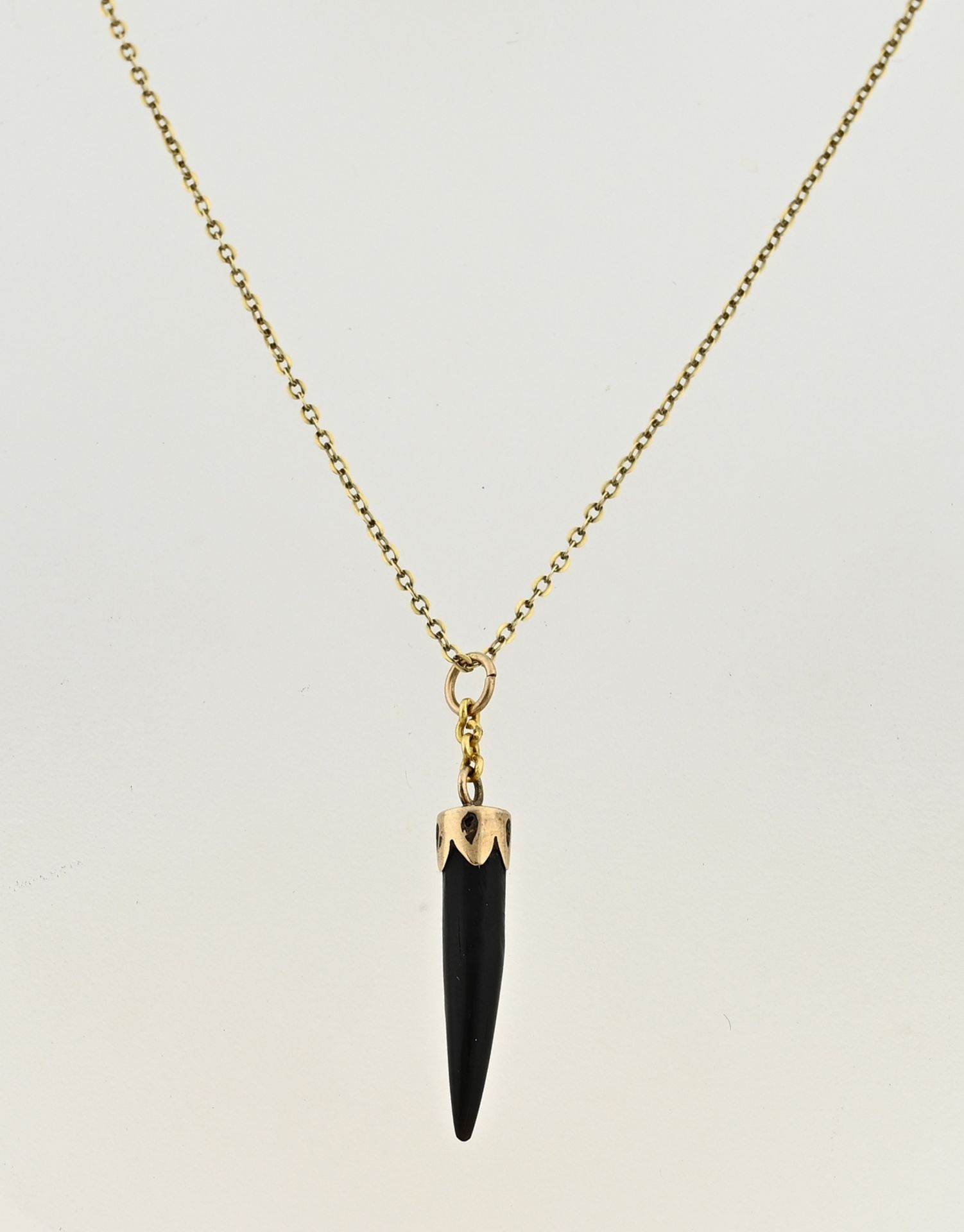 Gold necklace and pendant with animal claw