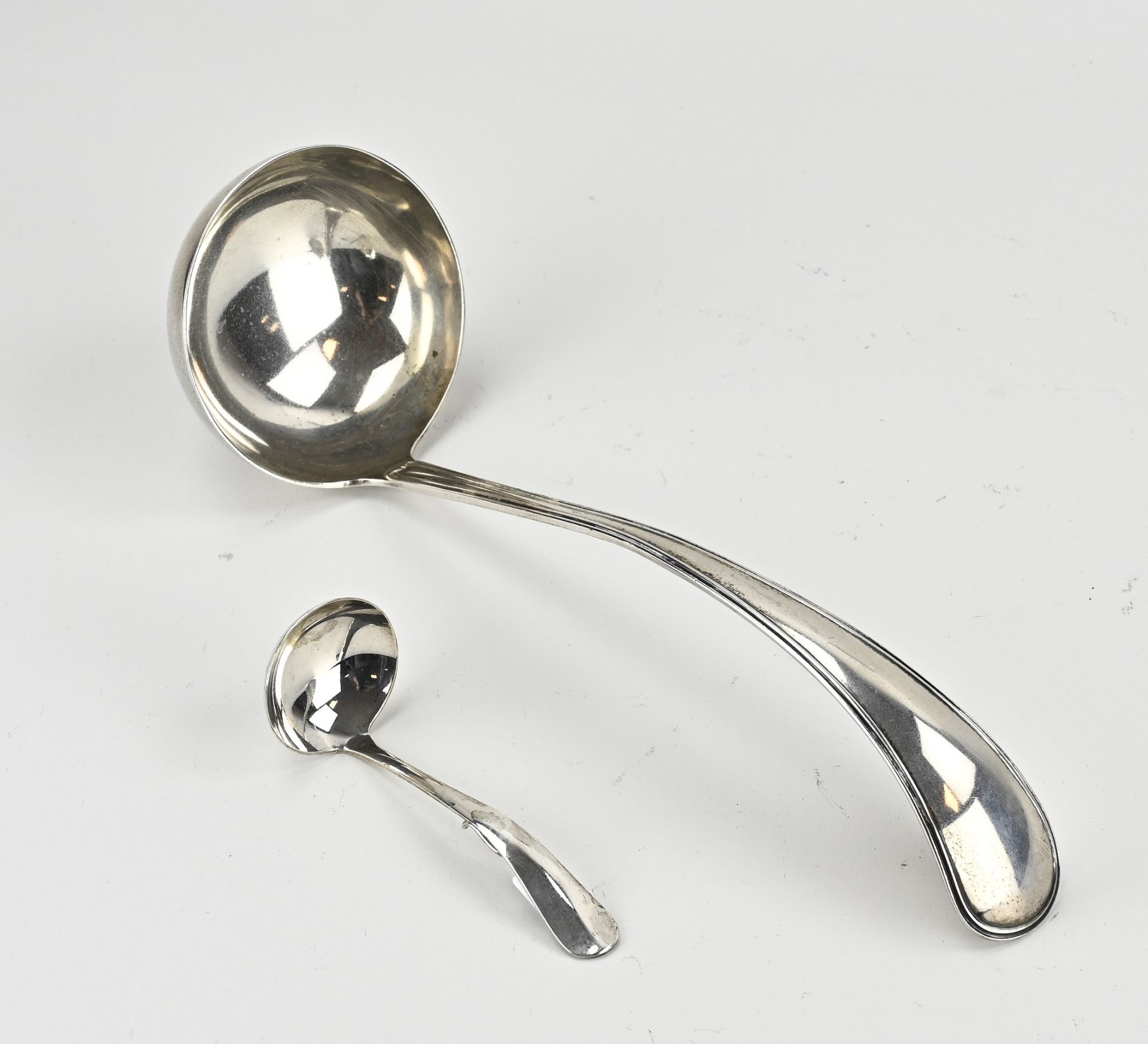 2 silver spoon (div.)