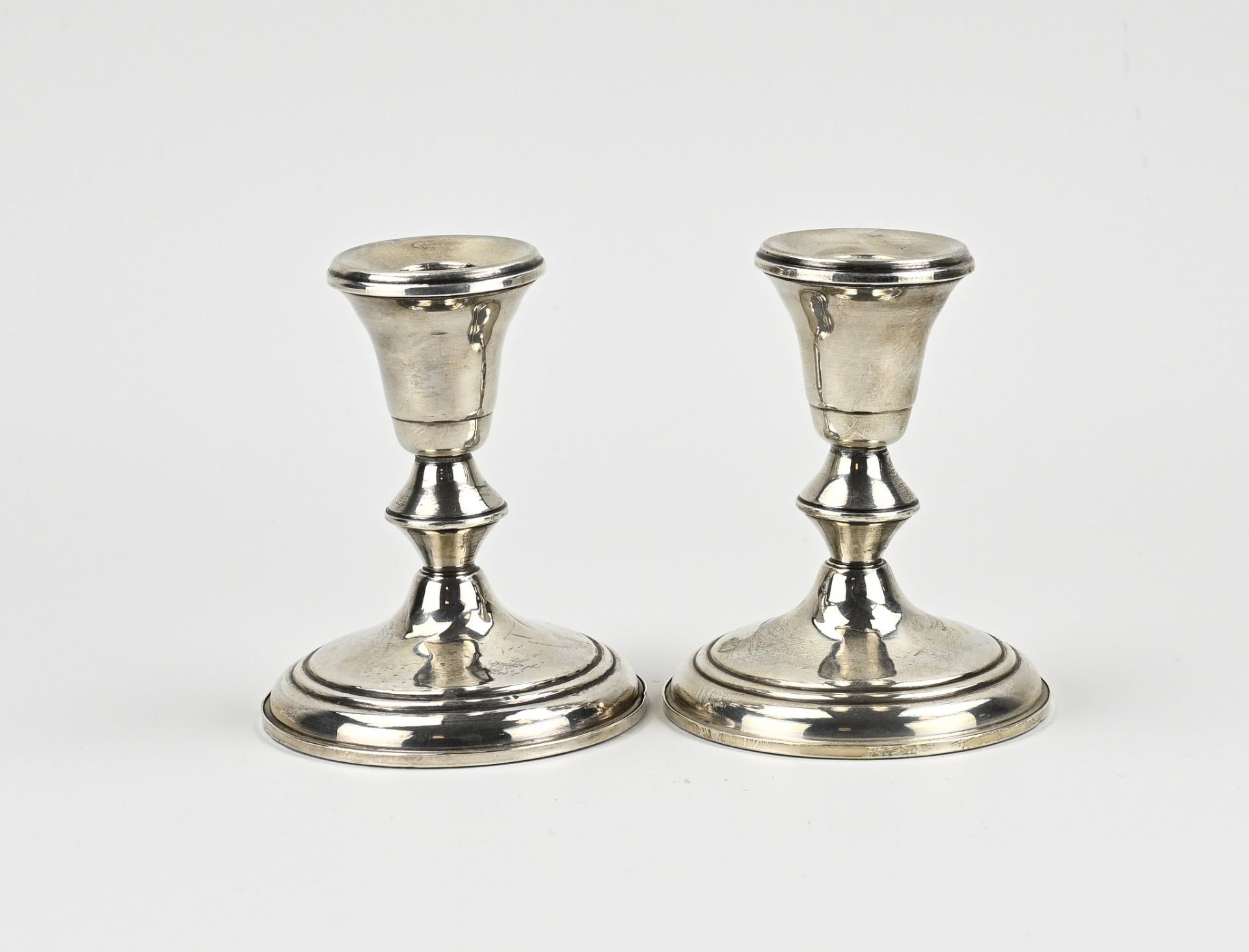 Pair of silver candlesticks,